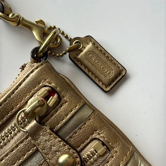 Gold metallic Coach legacy Zippy leather wristlet/baguette Clutch